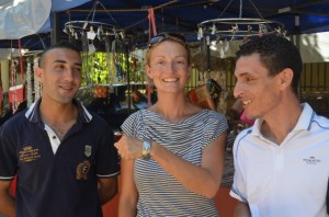Salim, our policeman, Susie and Hakim, our guide with the present they kindly bought Susie