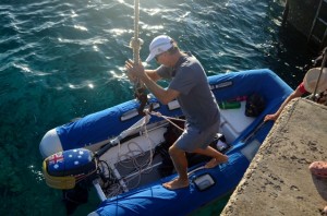 Our friend Laurie on Mona Roa gets his dinghy ready to be hoisted