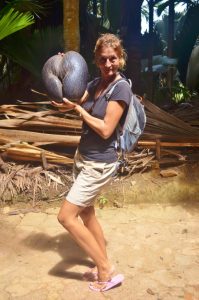 Susie holds up a coco de mer nut...